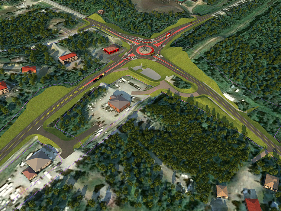 A rendering of the project area after construction from an airborne perspective, focused on the southwest corner. A firetruck approaches through a gap in the raised median on Bogard Road. An infiltration basin is immediately southwest of the roundabout, with maintenance ramps at each end. The business south of the existing intersection of Bogard Road with Green Forest Drive is accessed with driveways off of E. Ashmore Ave and Green Forest Drive. 